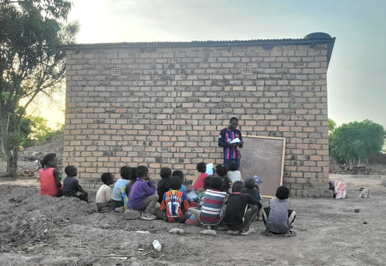 Children learning together in a community classroom in Congo