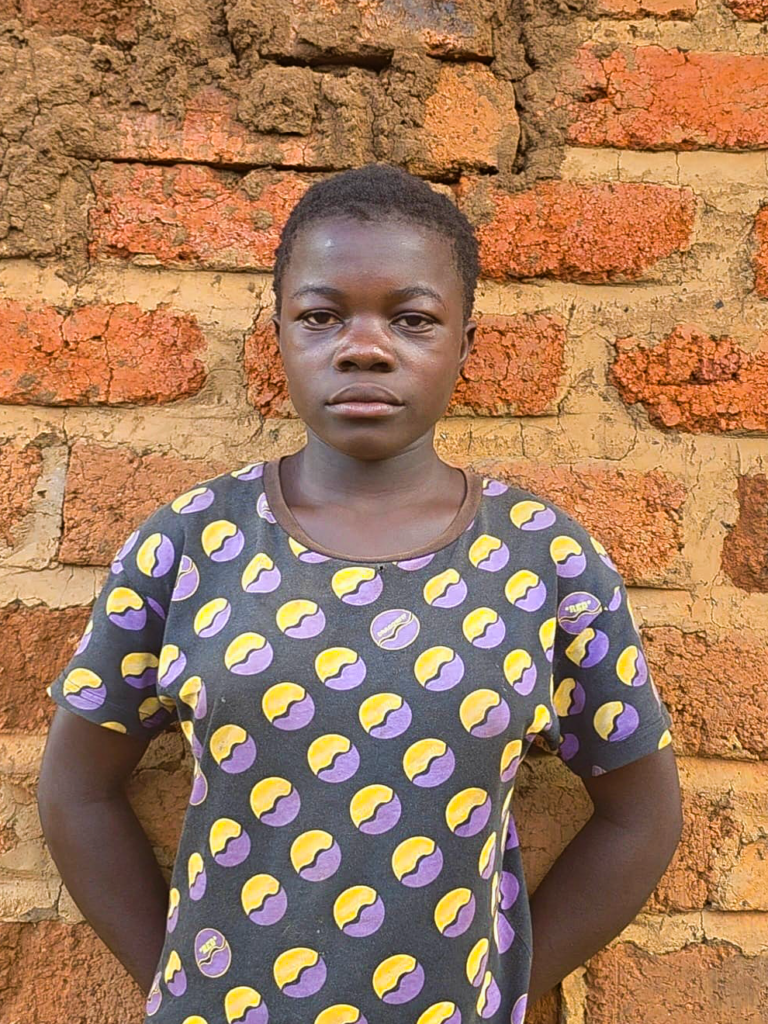 Dorcas, twelve years old, caring for her three younger siblings