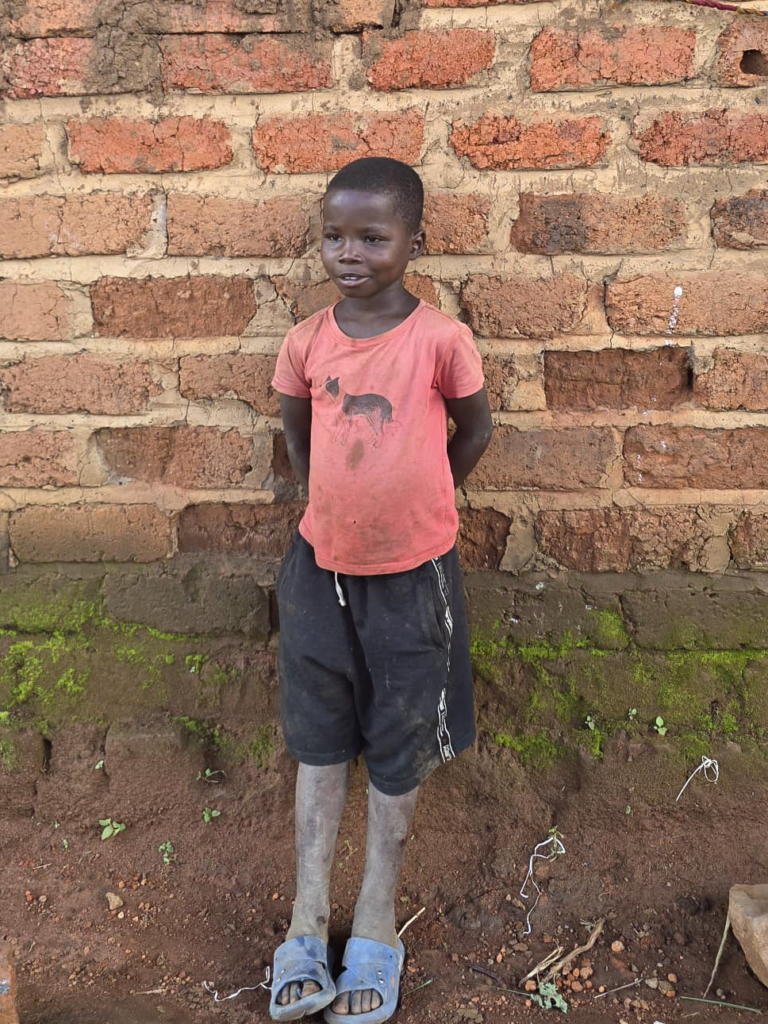 One of the younger brothers outside the family home